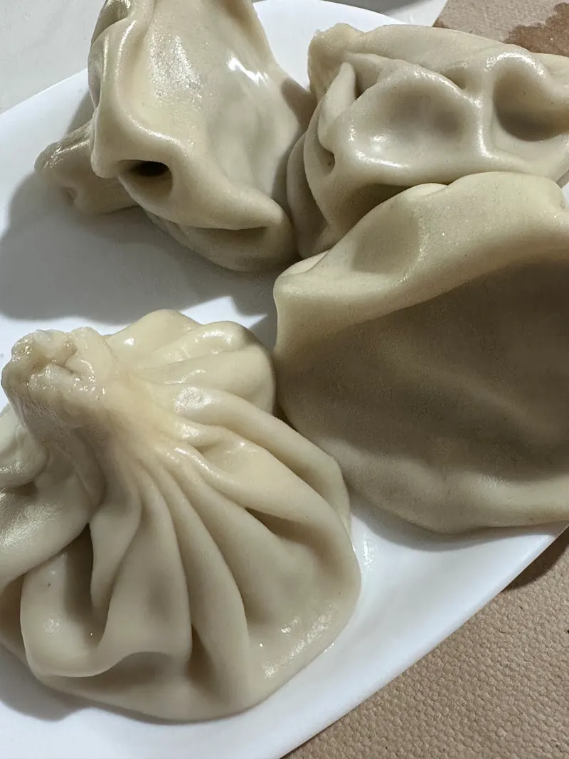 Khinkali dumplings on a white plate