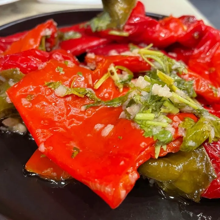 Red sweet peppers with garlic and herbs